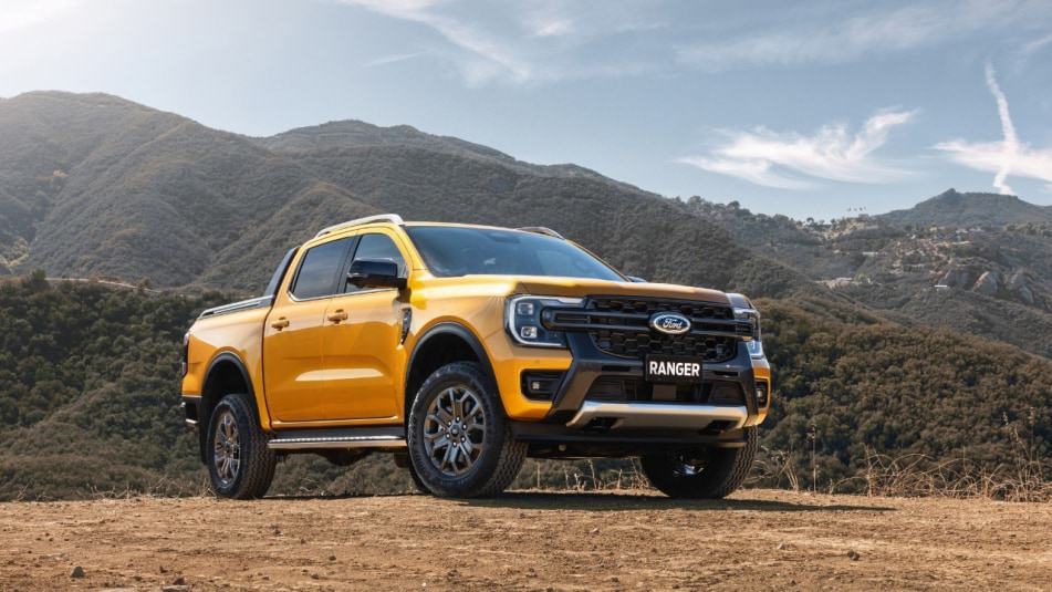 Yellow Ford Ranger van parked off-road